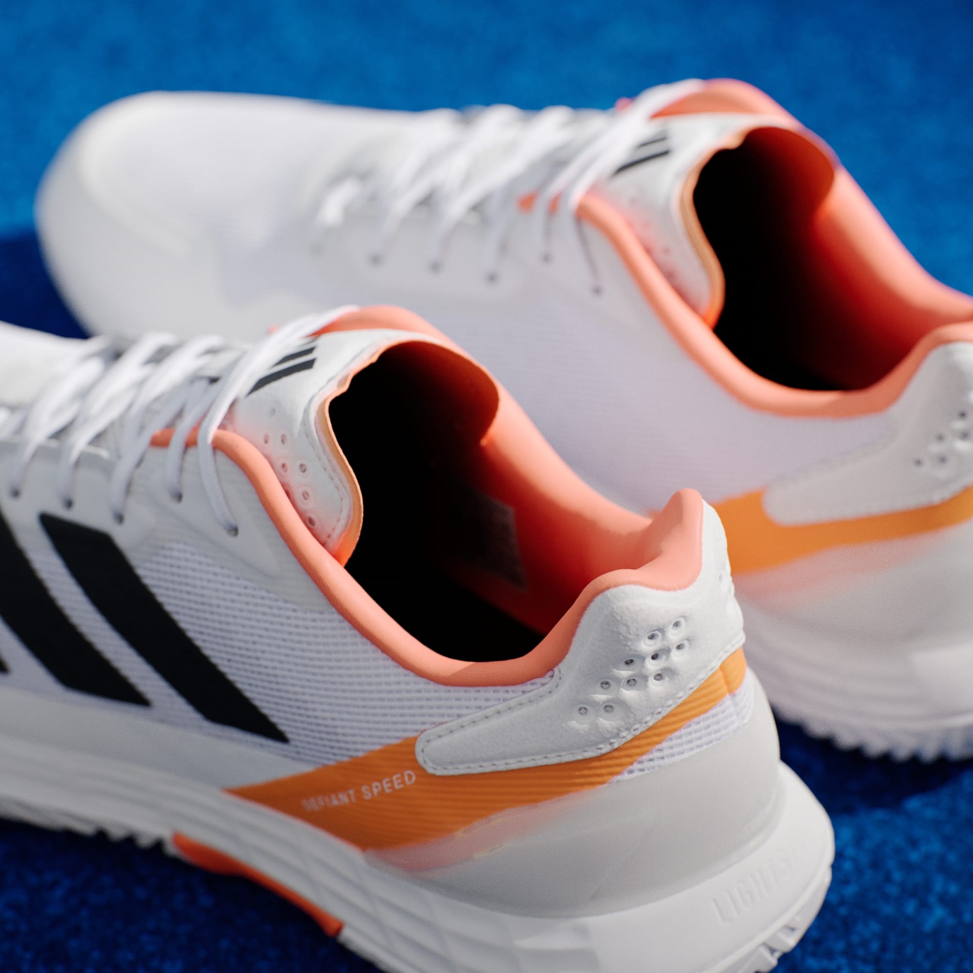 Zapatos de tenis Defiant Speed 2 Hombre Cloud White/Core Black/Lucid Orange